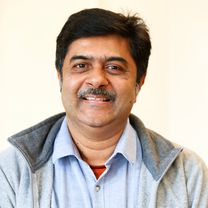 Prashanth Bogadi, an Indin man with short black hair and a black moustache