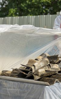 Construction workers removing asbestos