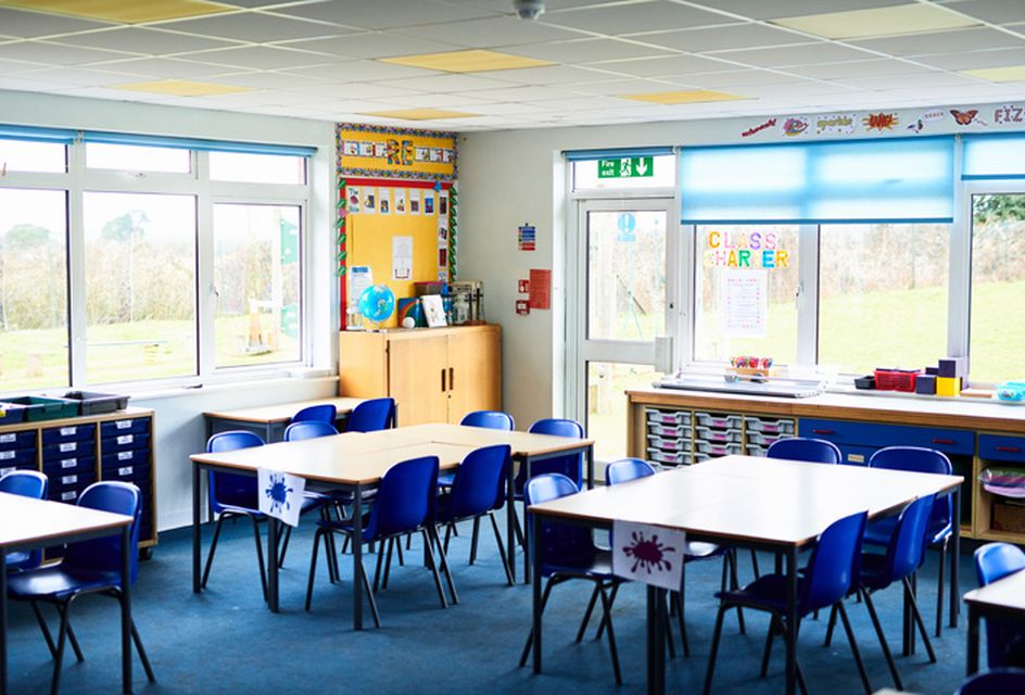 Image of an empty UK primary school classroom.