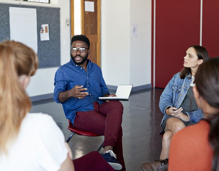 Student speaking in a seminar group - RSPH student member