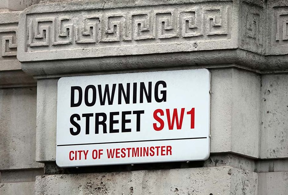 A street sign reading "Downing Street"