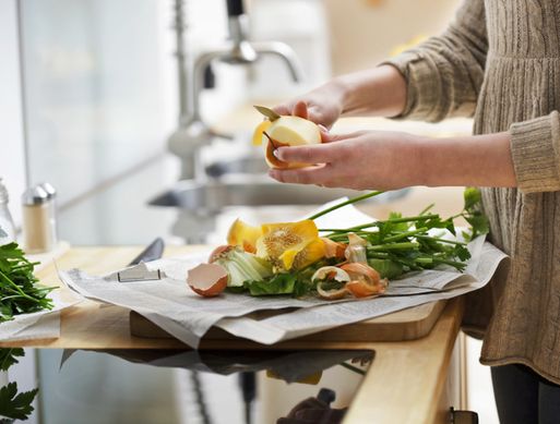Hands of a woman cutting vegetables