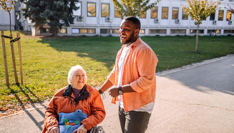 A care worker looking after an elderly woman