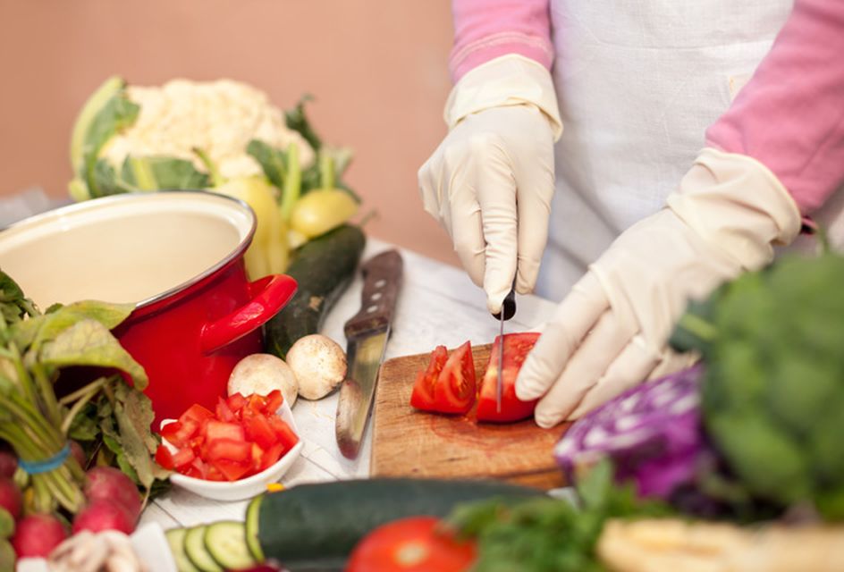 A person chopping vegetables for a healthy meal