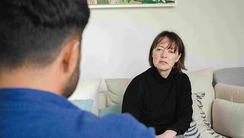 A female therapist talks to her patient