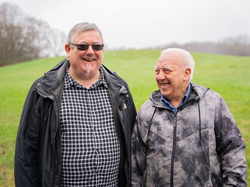 Two older men having a conversation