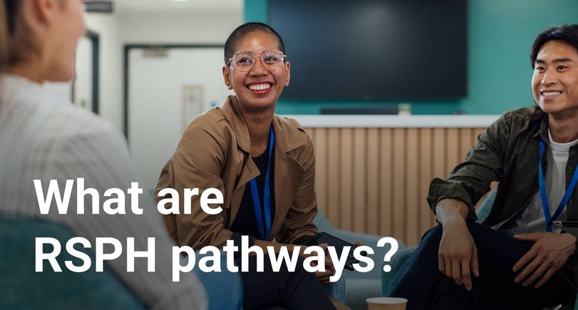 A group of people sitting in a classroom environment smiling, with text overlayed that reads "What are RSPH pathways?"