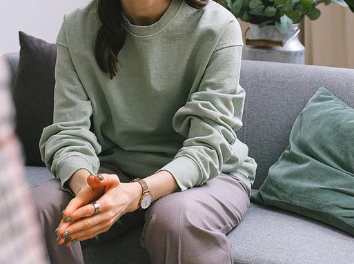 A close up of a woman's hands clasped together.